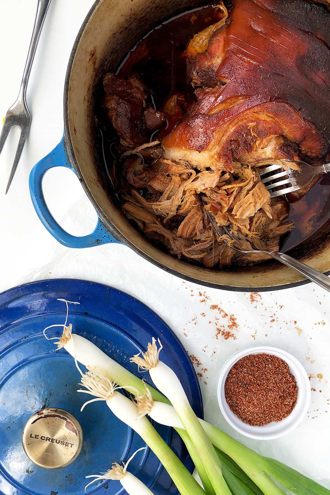 Easy pulled pork recipe cooked in cast iron pot