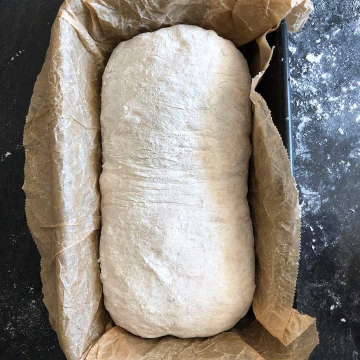 proving sourdough in a loaf tin