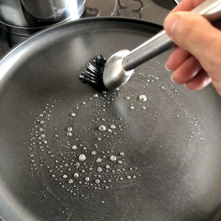 greasing a pan with butter